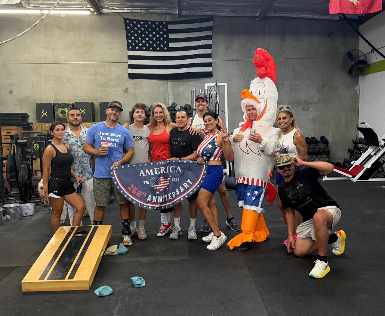 The Decoded crew gathered under the flag and 250th Anniversary banner on Freedom WOD night