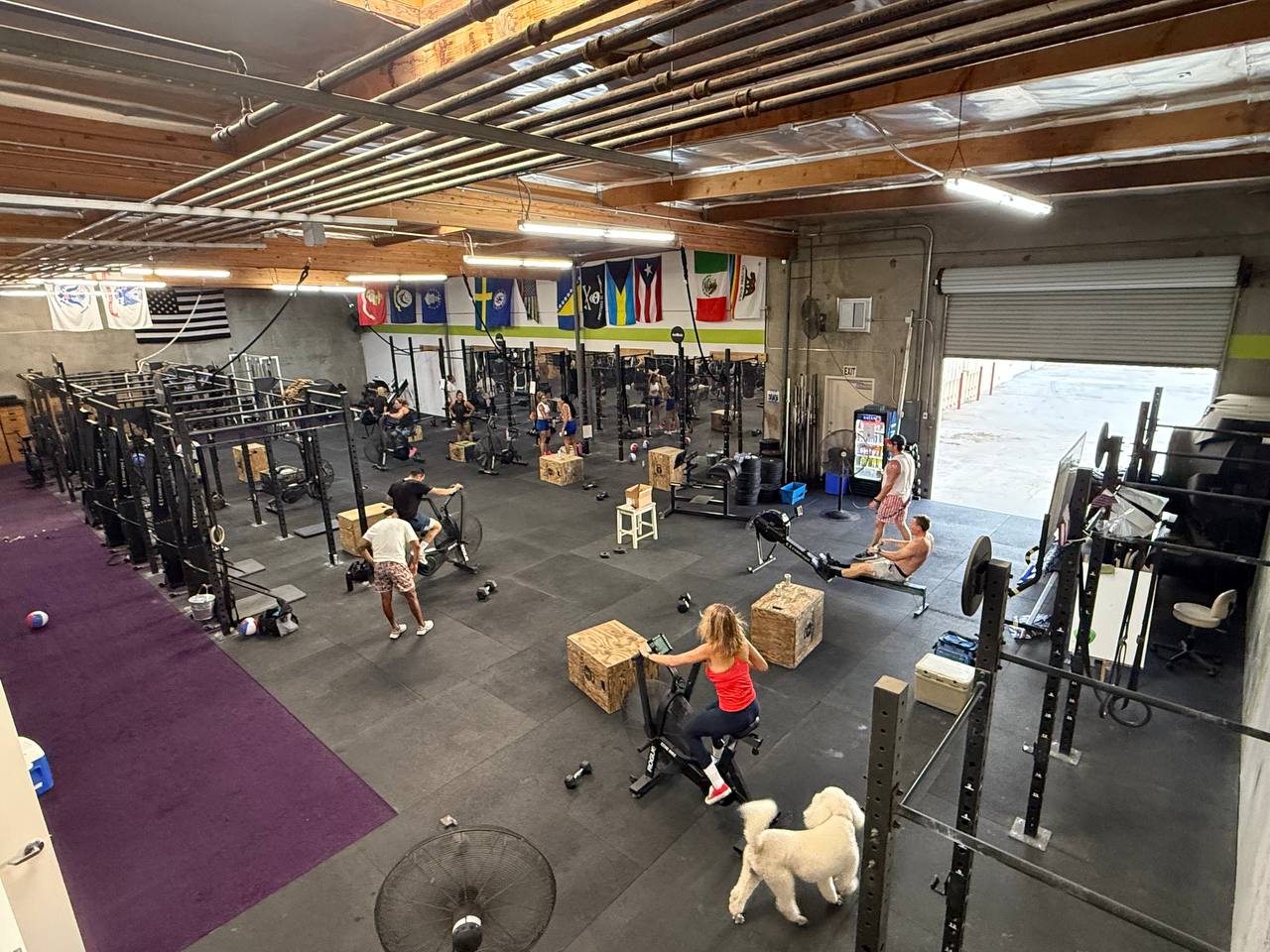 Wide overhead view of the whole gym floor mid-workout on Freedom WOD night